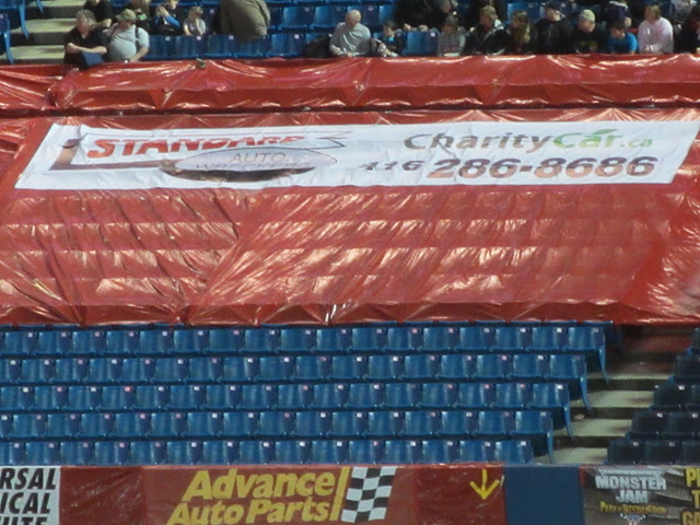 charity car and saw sponsor banner